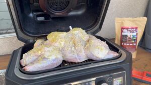 Positioning the turkey inside the Woodfire XL