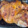 Lemon pepper turkey smoking on the Woodfire grill