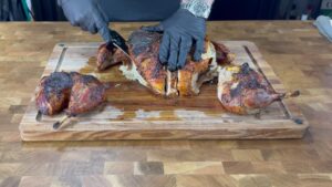 Carving the cooked turkey breast